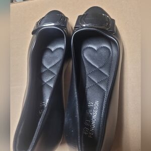 Black low heel buckled flats